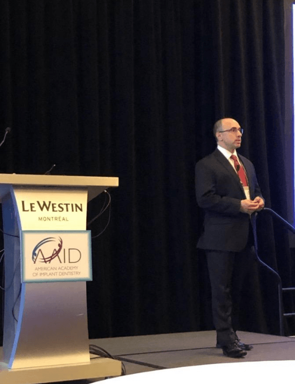 Dr Goldberg at a seminar giving a speech and presentation