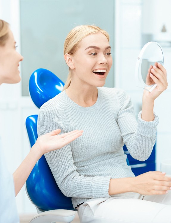 Young woman smiling happily after a smile makeover in Succasunna