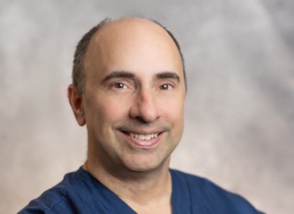smiling DR. Ira Goldberg