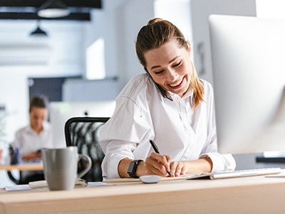 Woman smiling while working in office