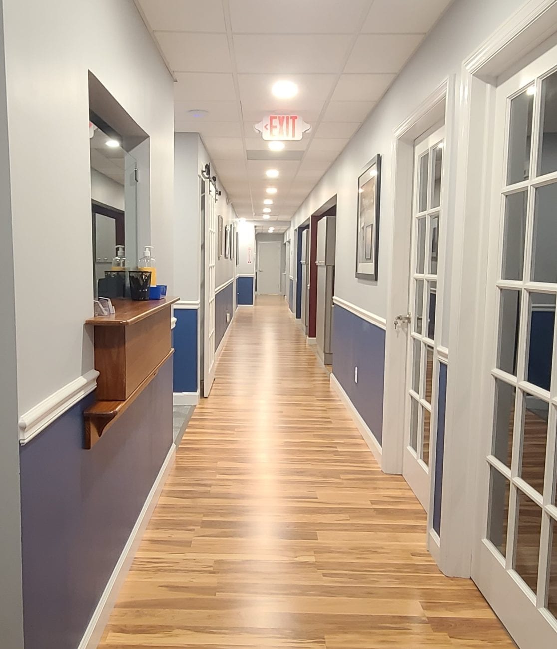 Hallway branching off into various dental rooms